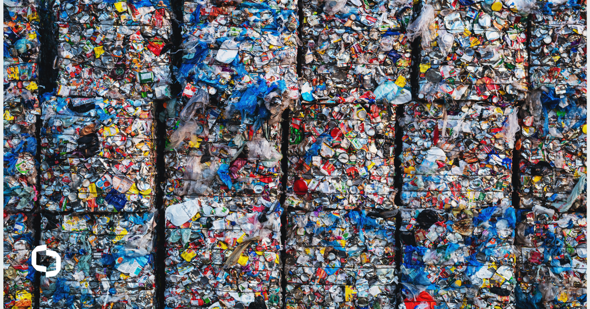 Stacks of plastic waste in a landfill, highlighting the severity of the plastic waste problem.