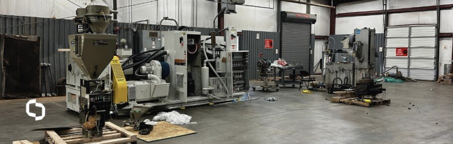 Compounding machinery inside Extera's North Carolina warehouse, showcasing their expertise in recycled plastic processing. The industrial equipment is used for advanced compounding services, supporting sustainable manufacturing and material reuse.