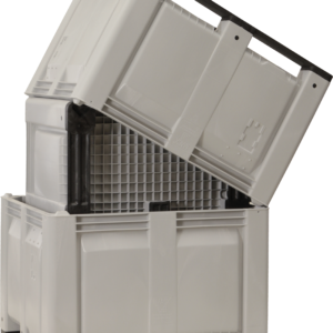 Three gray Longside agriculture containers nested together, showing the grated base and corner posts that let units stack securely.